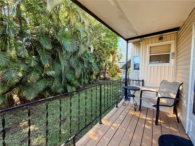 a view of a two chairs in the balcony