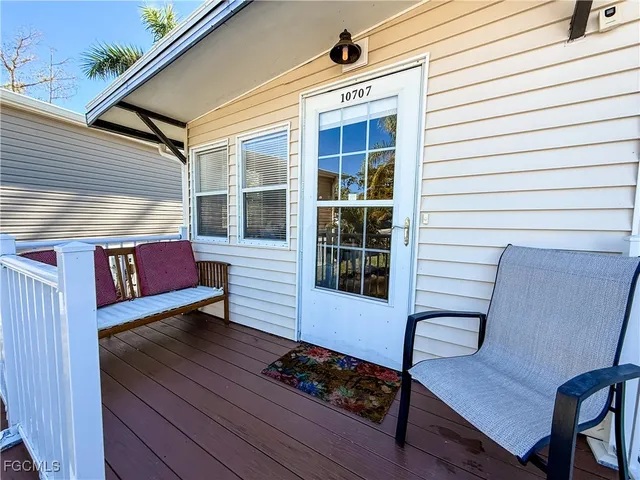 a view of a two chairs in the balcony