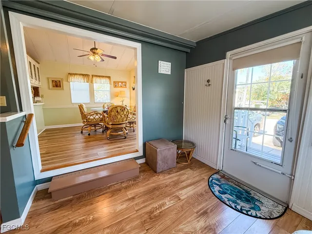 a view of living room with furniture and wooden floor