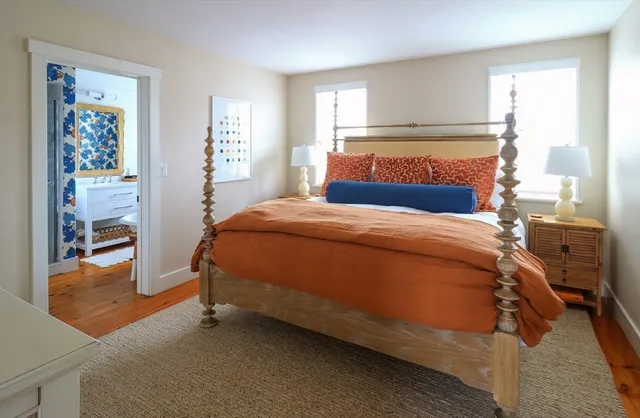 a bedroom with a bed and a cabinets