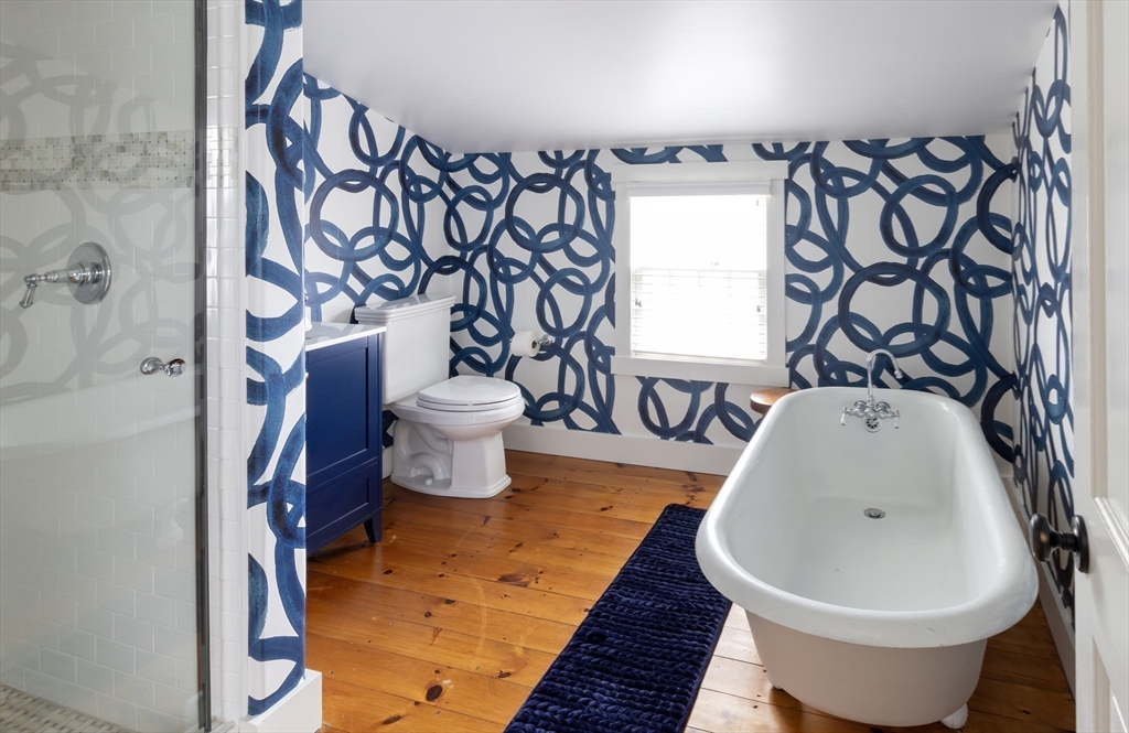 10 Lyon Street Nantucket, MA 02554 - Photo 20 of 23 a bathroom with a bathtub and shower