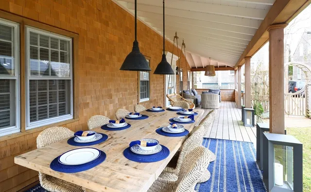 a view of a dining room and hall with furniture