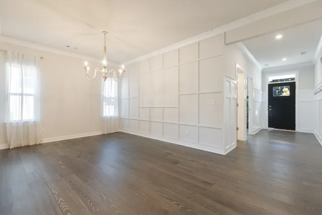 a view of a living room a flat screen tv and a fireplace