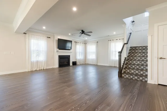 a living room with a fireplace and a flat screen tv