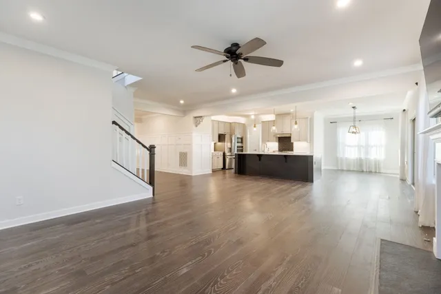 a kitchen with lots of counter space a sink appliances and cabinets