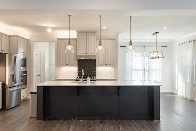a view of a livingroom with a ceiling fan and window
