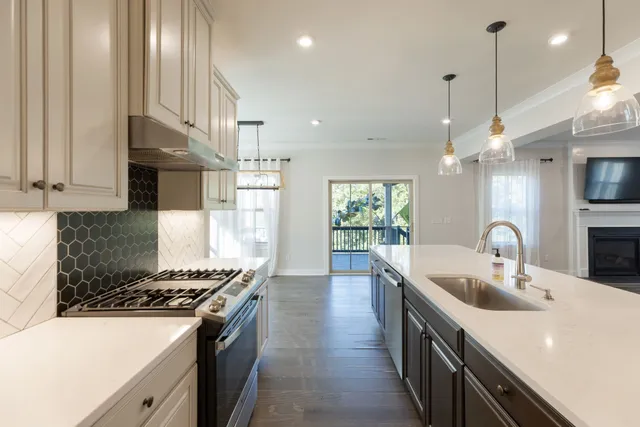 a bathroom with double sink and two mirror