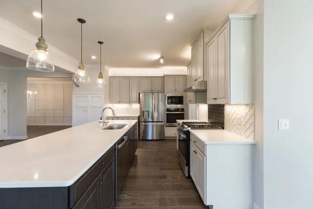 a bathroom with double sink and a mirror