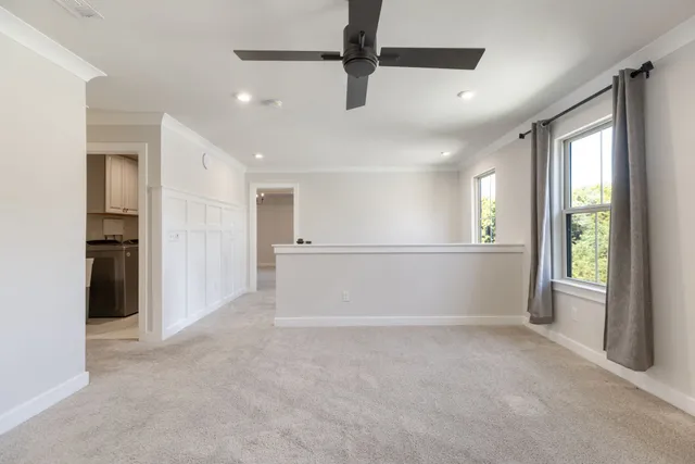 a view of a room with shelf on the wall