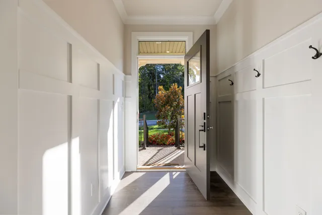 a bathroom with a sink toilet vanity and shower