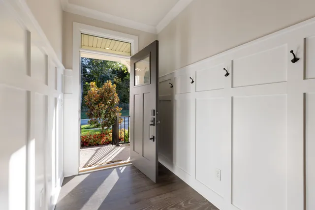 a bathroom with a sink toilet vanity and shower