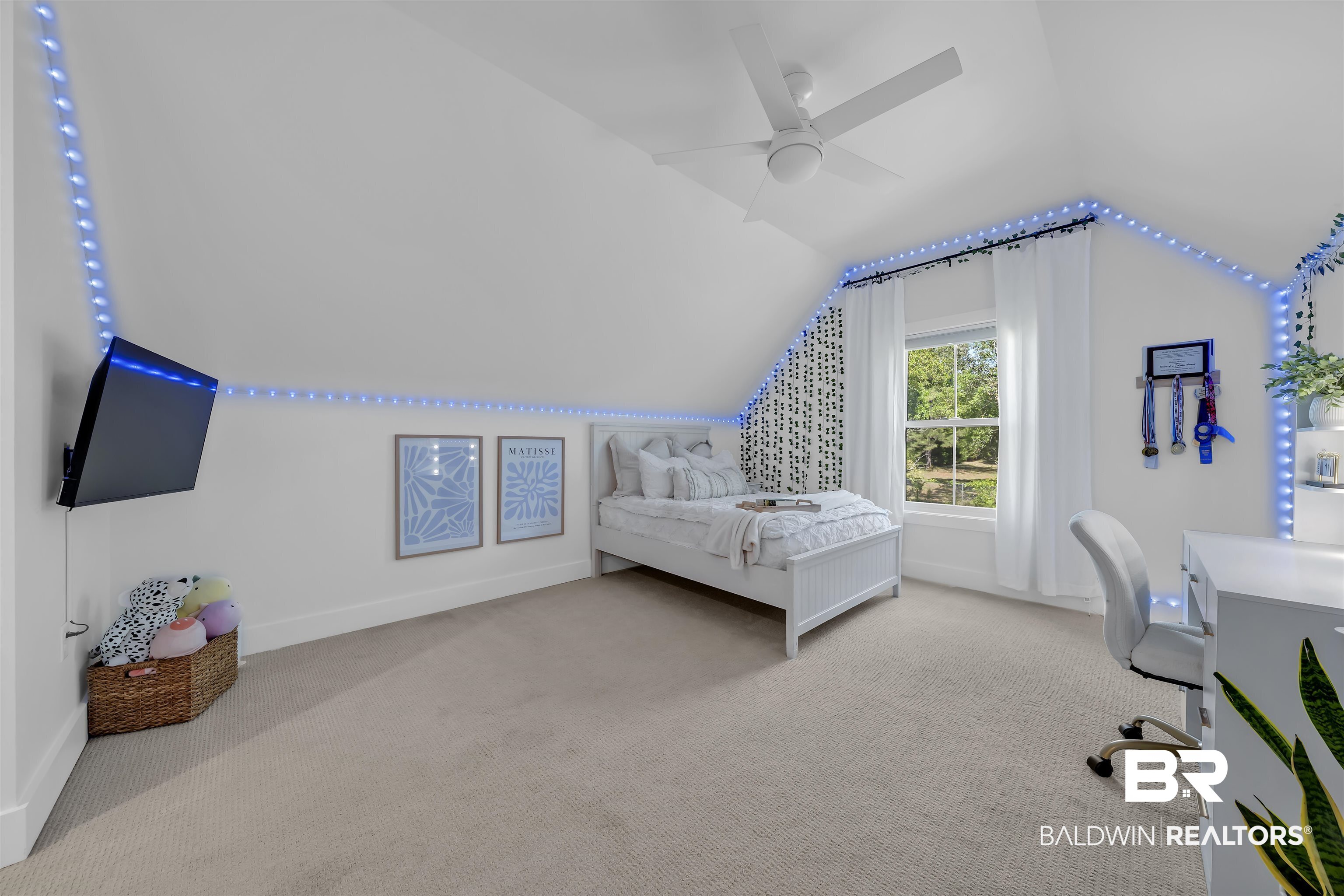 19058 James Road Gulf Shores, AL 36542 - Photo 27 of 49 Bedroom with light carpet, vaulted ceiling, a ceiling fan, and an office area