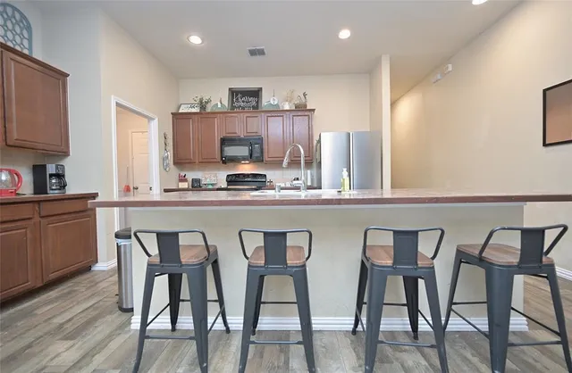 a kitchen with a sink cabinets and appliances