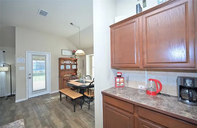 a living room with furniture a rug and a window