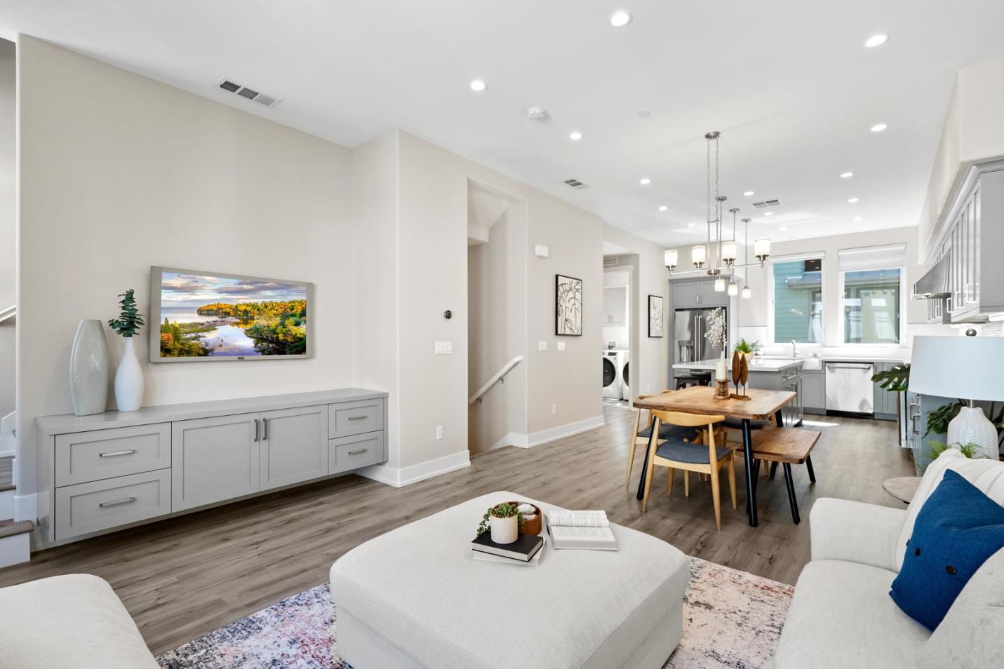 653 Agave Terrace Sunnyvale, CA 94086 - Photo 13 of 44 a living room with furniture a dining table and a flat screen tv