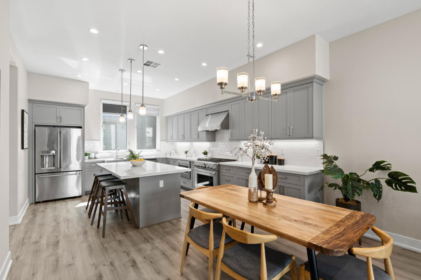 653 Agave Terrace Sunnyvale, CA 94086 - Photo 16 of 44 a kitchen with kitchen island a table and chairs in it