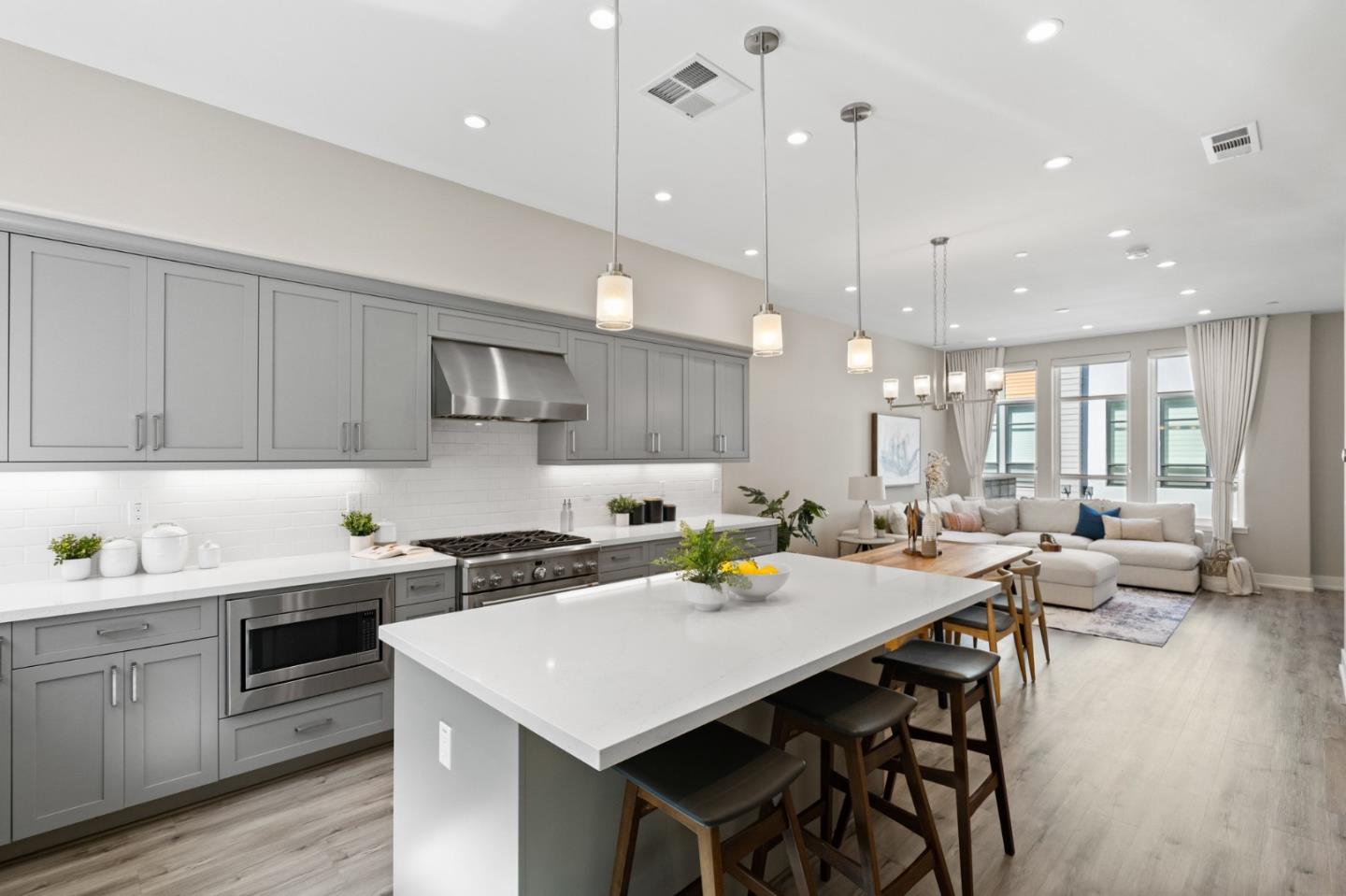 653 Agave Terrace Sunnyvale, CA 94086 - Photo 17 of 44 a kitchen that has a lot of cabinets a sink and appliances in it
