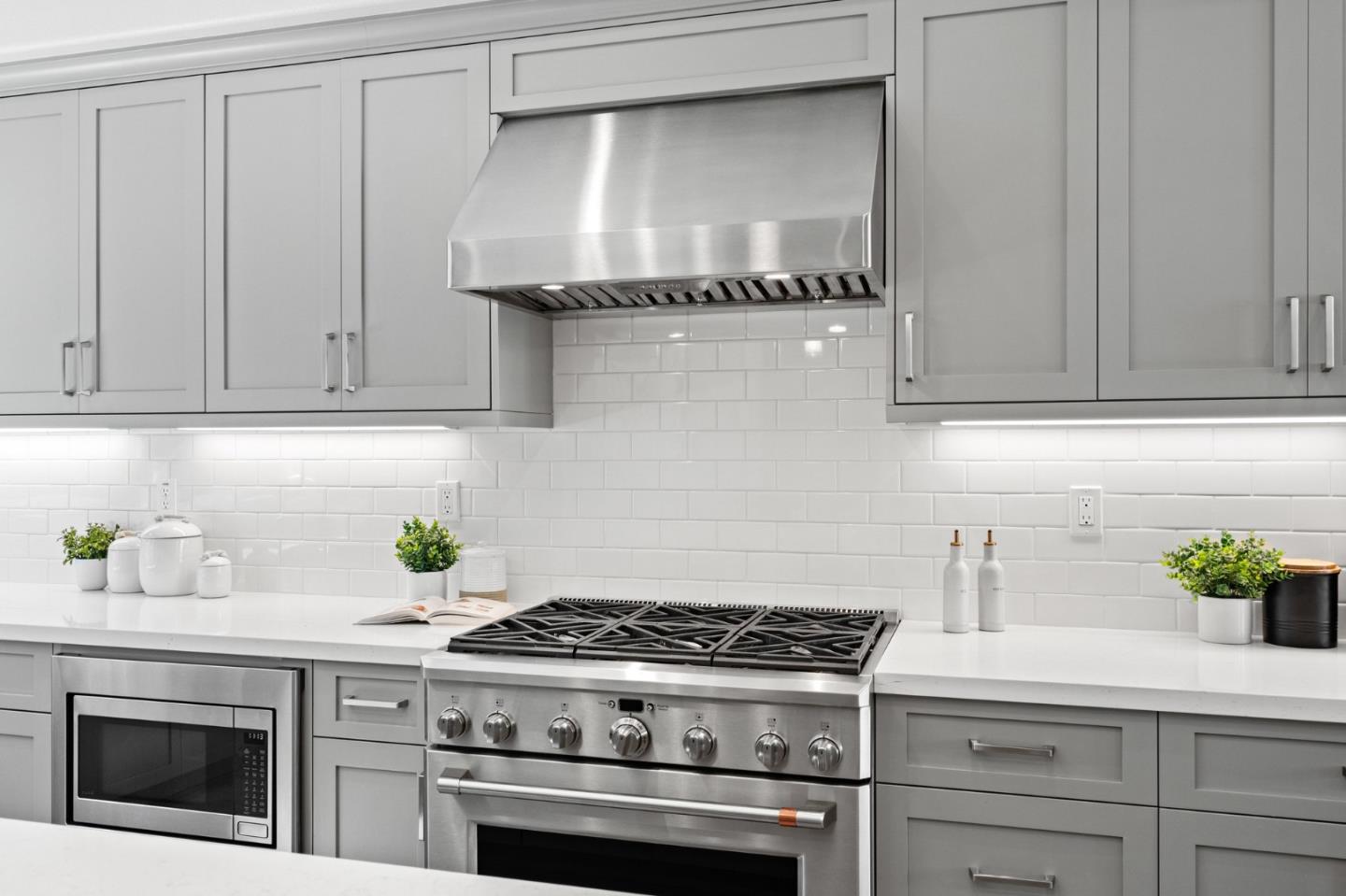 653 Agave Terrace Sunnyvale, CA 94086 - Photo 20 of 44 a stove top oven sitting inside of a kitchen