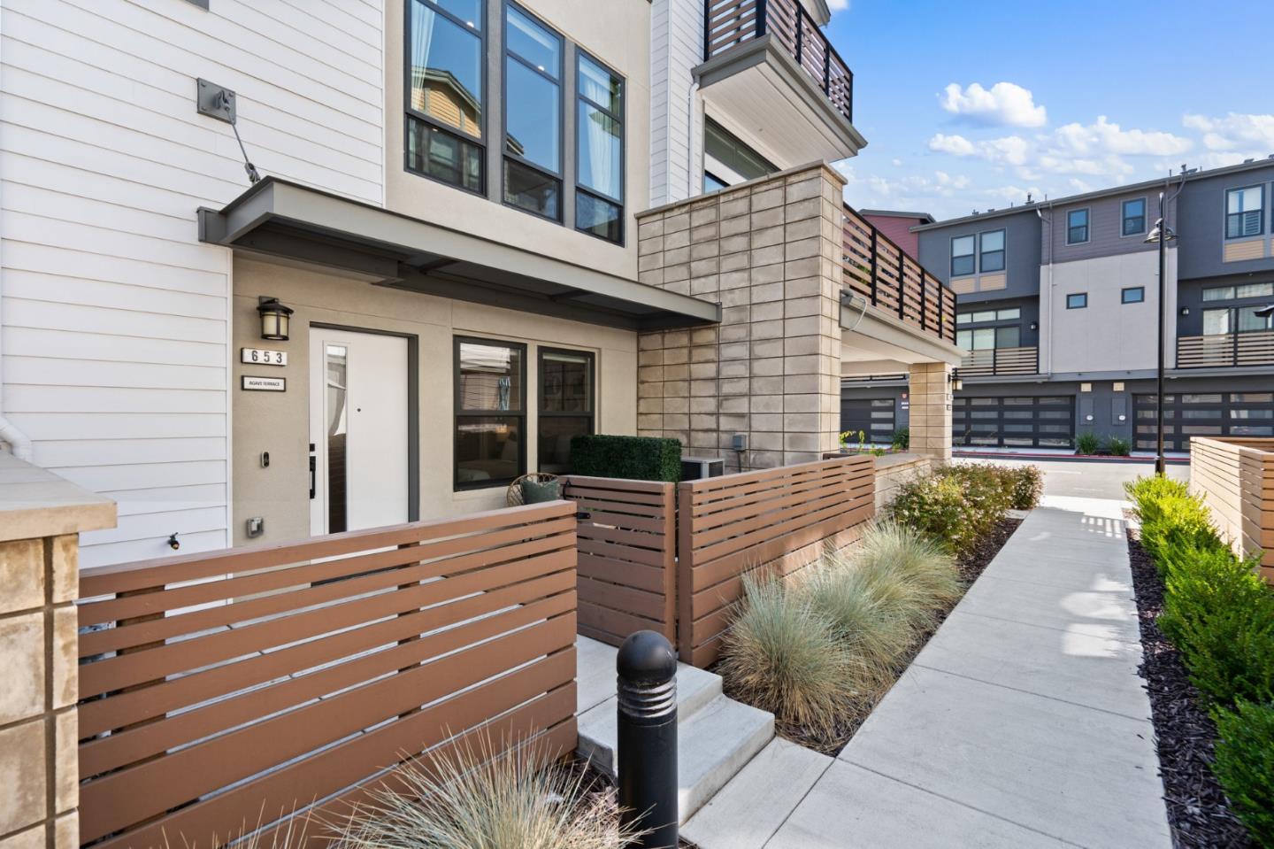 653 Agave Terrace Sunnyvale, CA 94086 - Photo 2 of 44 a view of a patio with couches chairs and potted plants