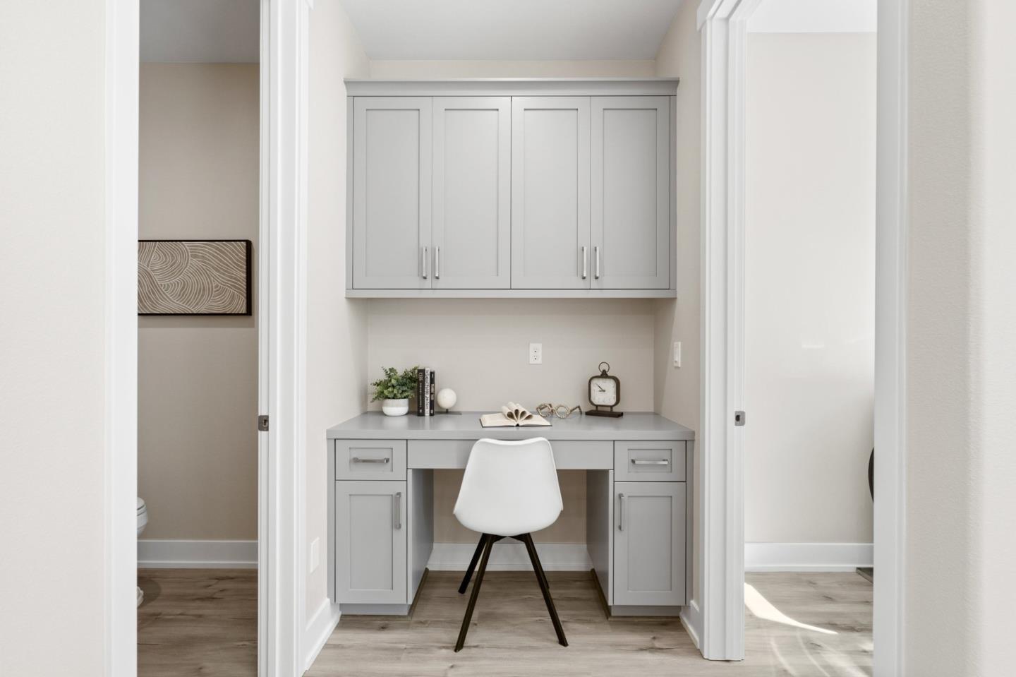 653 Agave Terrace Sunnyvale, CA 94086 - Photo 21 of 44 a view of a room with cabinets wooden floor and a window