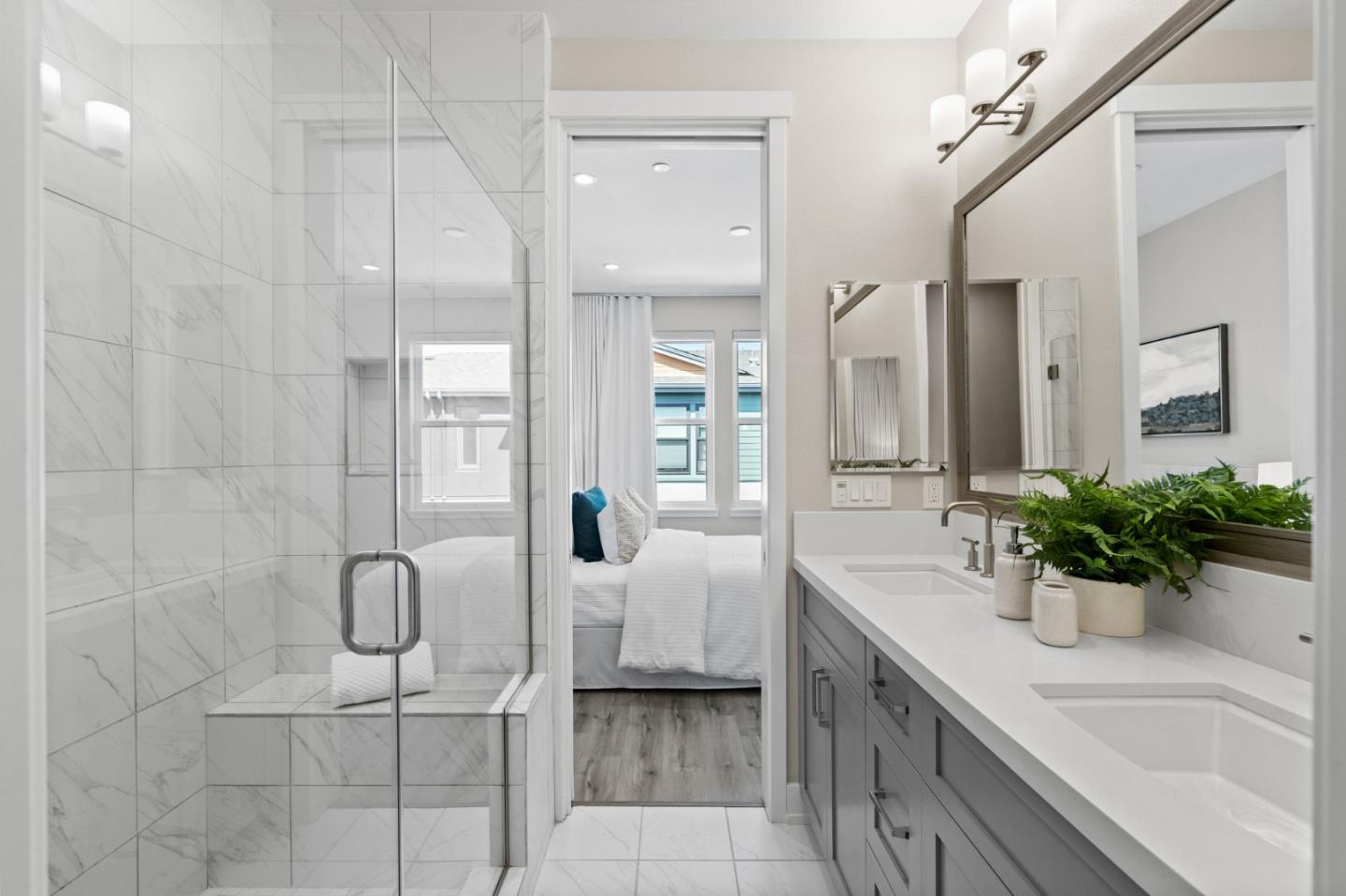653 Agave Terrace Sunnyvale, CA 94086 - Photo 29 of 44 a spacious bathroom with a double vanity sink a large mirror and shower