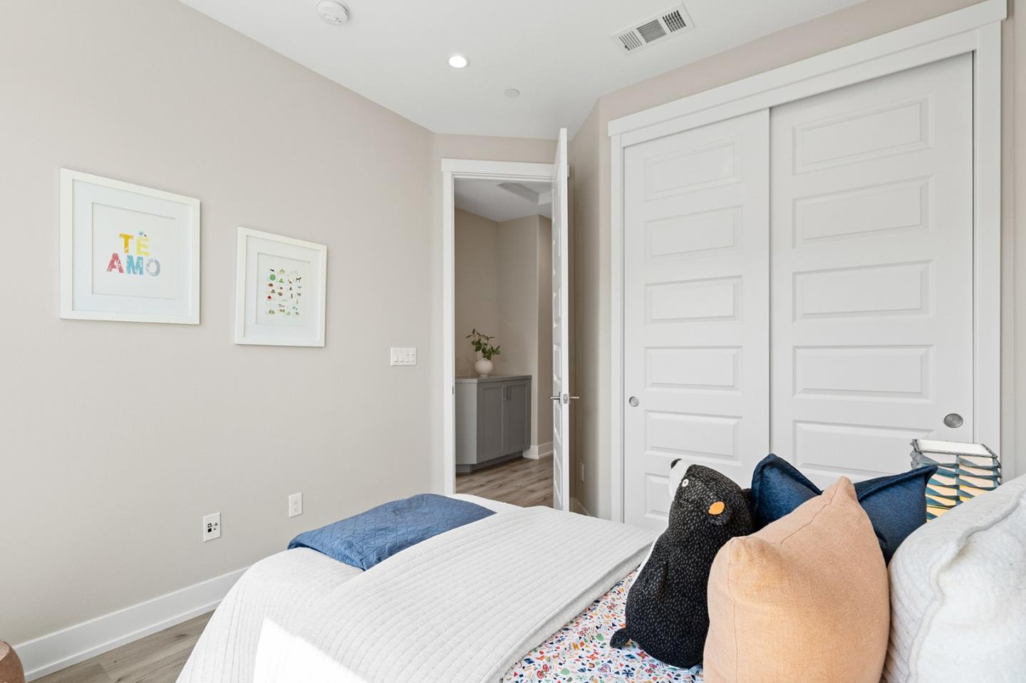 653 Agave Terrace Sunnyvale, CA 94086 - Photo 31 of 44 a bedroom with a bed and a walk in closet