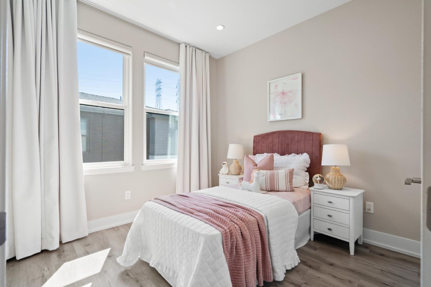 653 Agave Terrace Sunnyvale, CA 94086 - Photo 32 of 44 a bedroom with a bed and a window