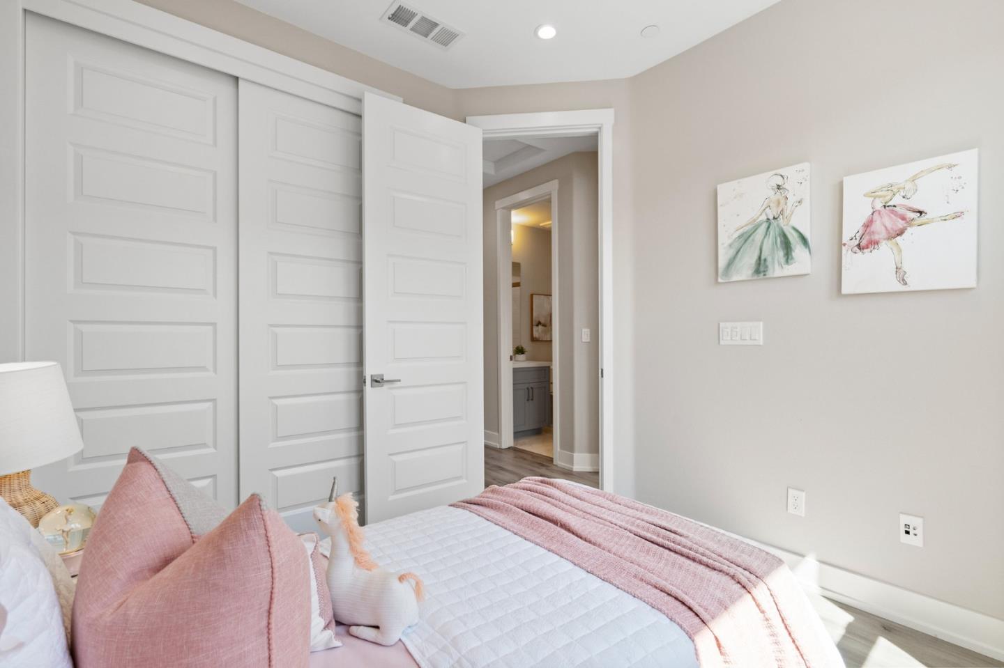 653 Agave Terrace Sunnyvale, CA 94086 - Photo 33 of 44 a bedroom with a bed and the wall painting