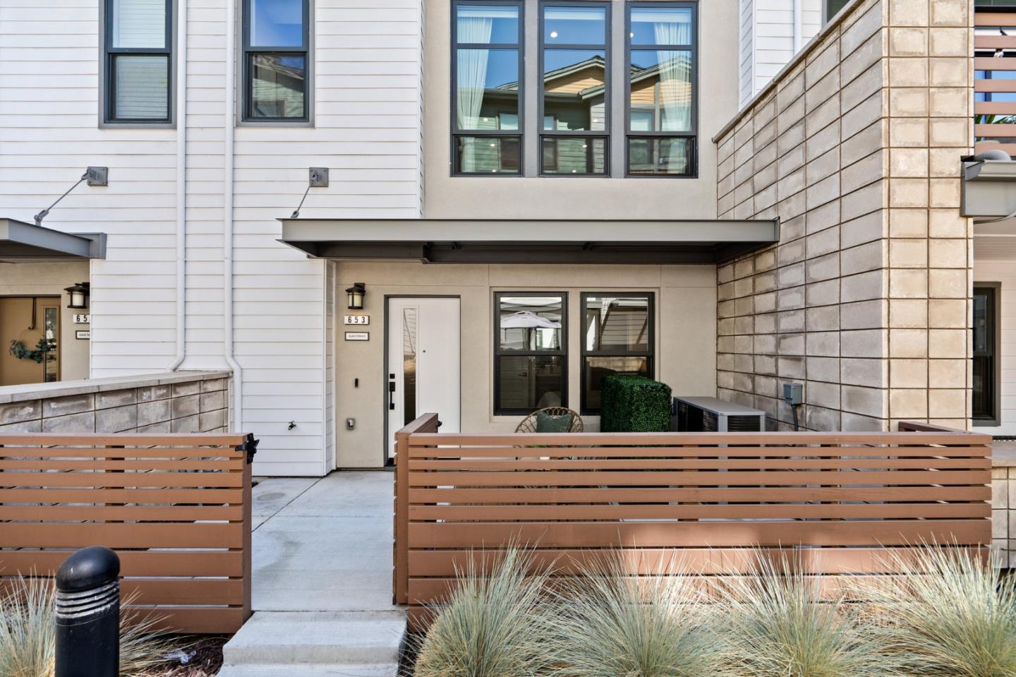 653 Agave Terrace Sunnyvale, CA 94086 - Photo 4 of 44 a view of a brick house with many windows