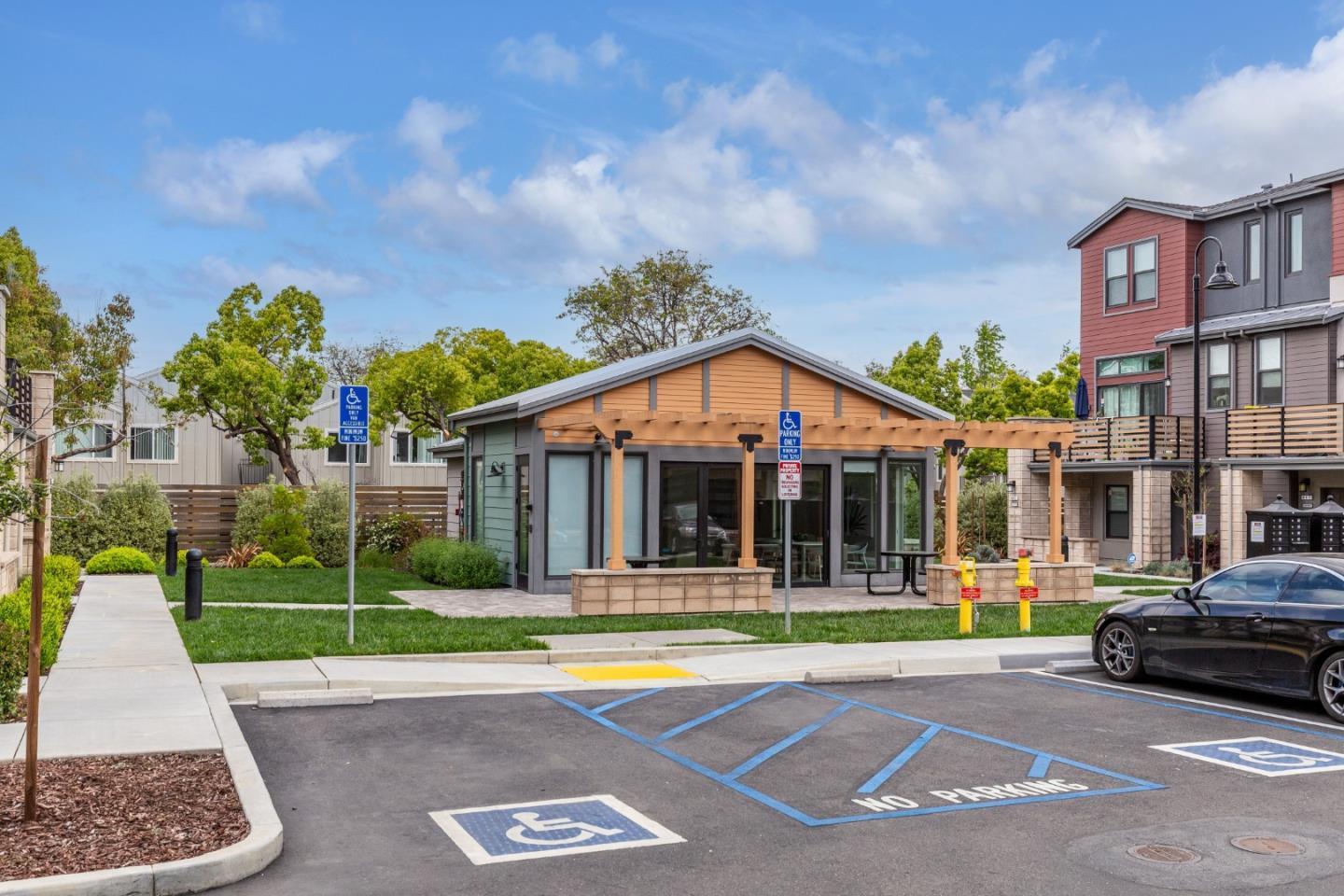 653 Agave Terrace Sunnyvale, CA 94086 - Photo 42 of 44 a view of a big house with a fountain plants and palm trees