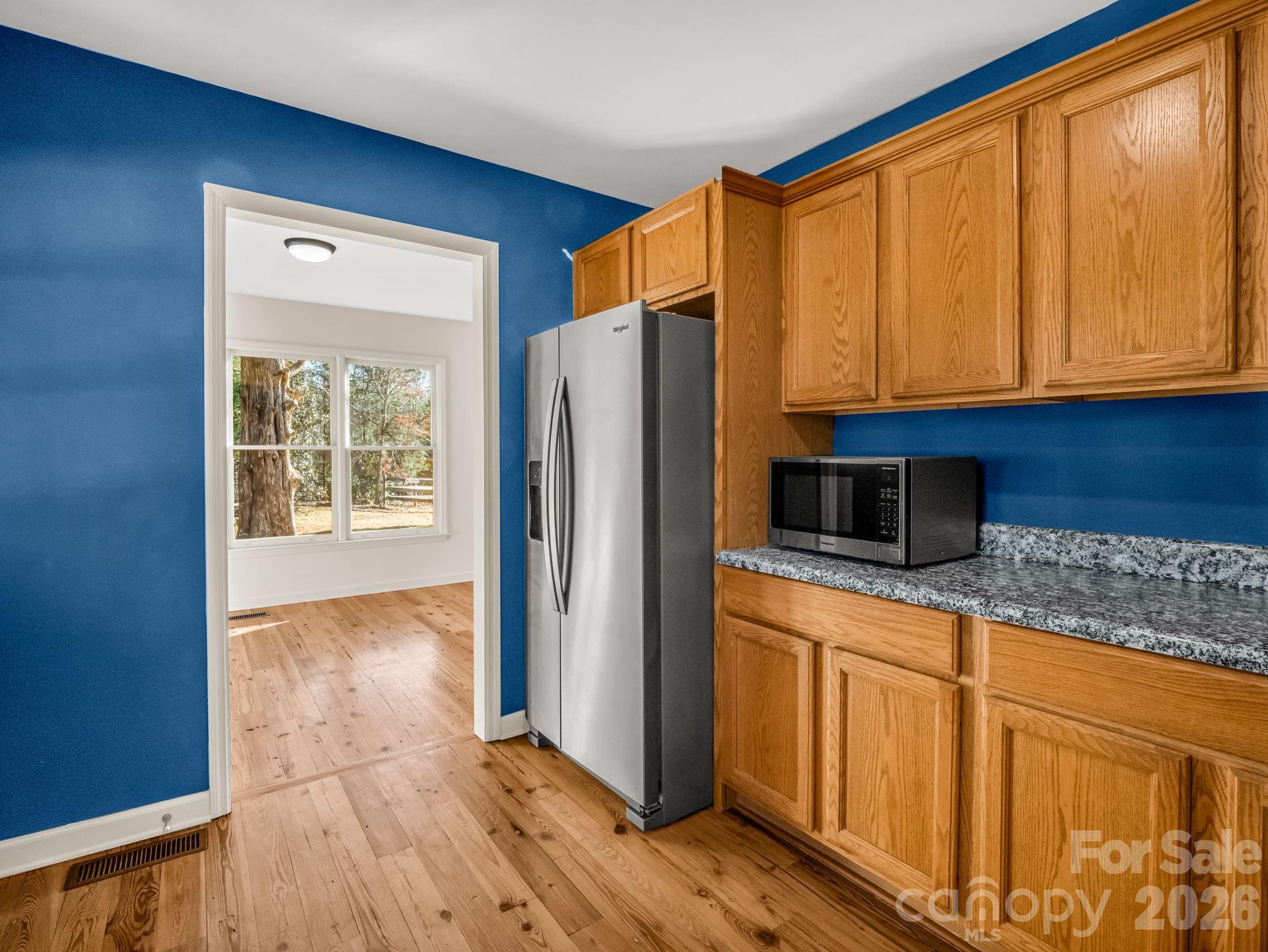 3205 Collinsville Road Columbus, NC 28722 - Photo 11 of 48 a kitchen with stainless steel appliances granite countertop a refrigerator and a stove top oven