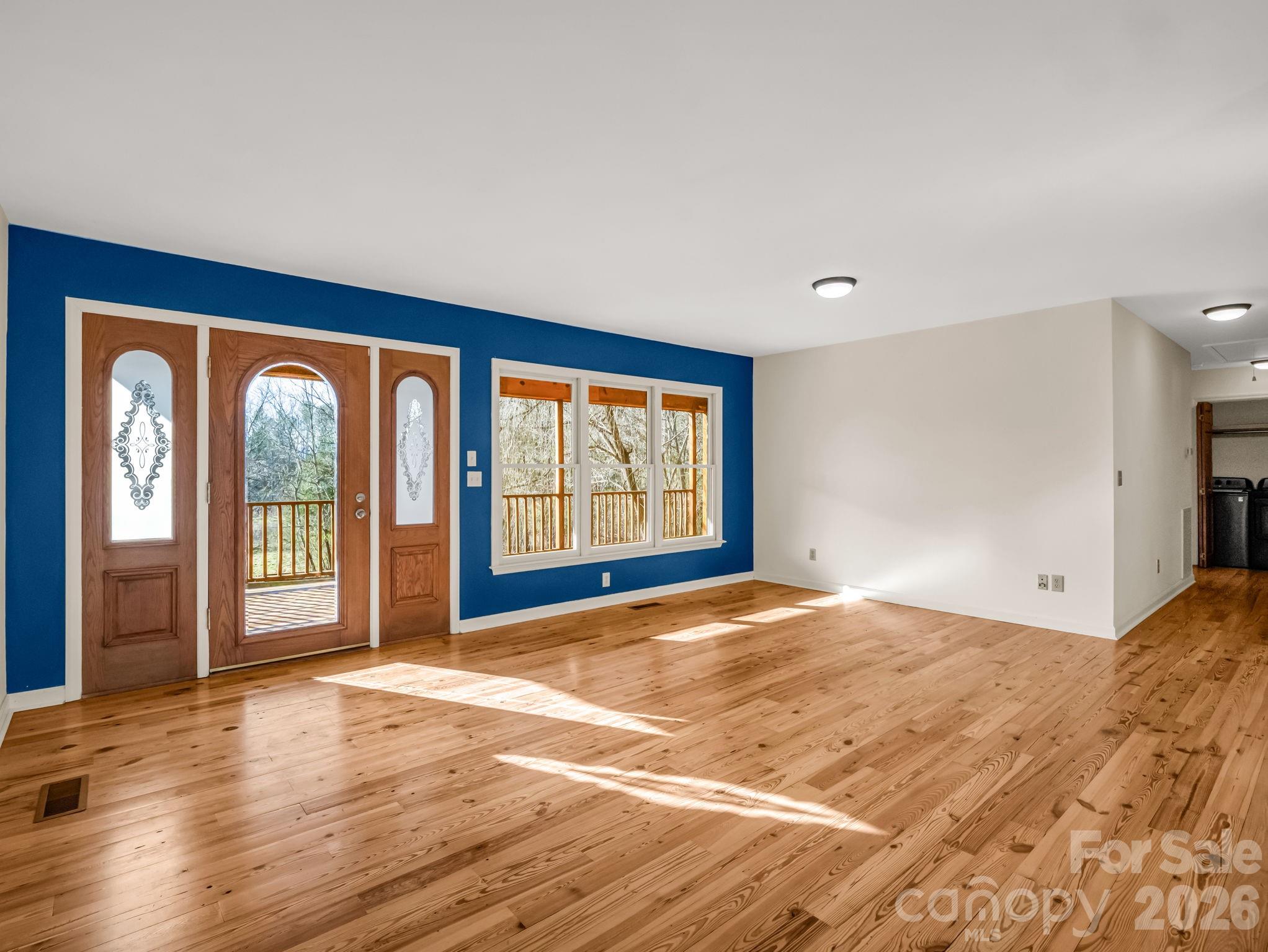 3205 Collinsville Road Columbus, NC 28722 - Photo 13 of 48 a view of an empty room with glass door and balcony