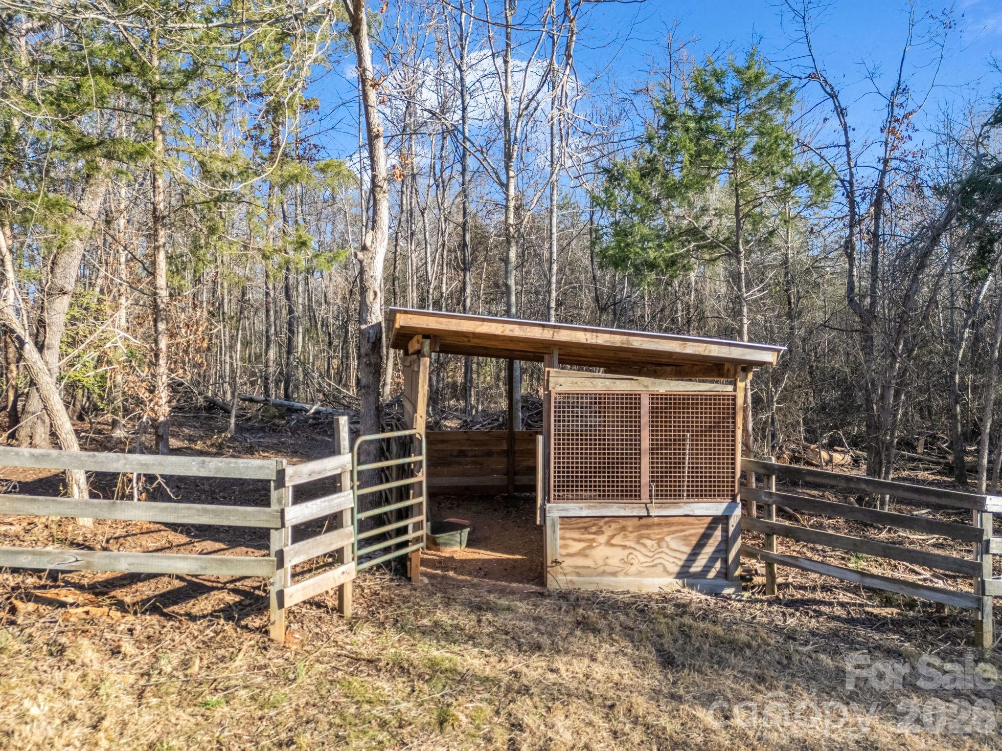 3205 Collinsville Road Columbus, NC 28722 - Photo 27 of 48 a view of backyard with wooden fence and a large tree