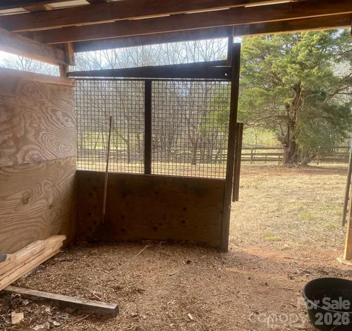 a view of outdoor space with trees in the background