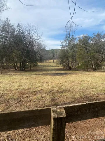 a view of swimming pool with a yard