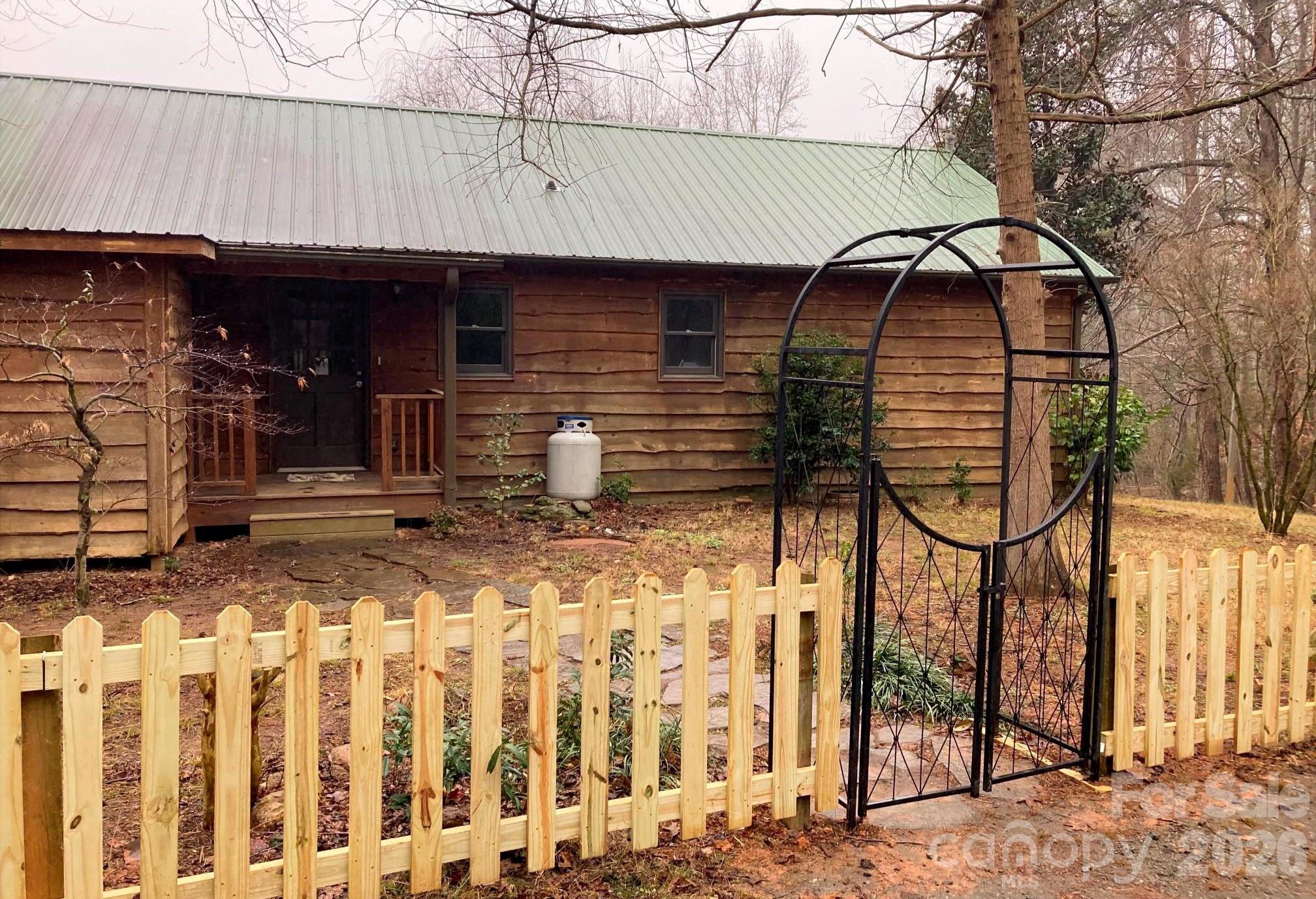 3205 Collinsville Road Columbus, NC 28722 - Photo 8 of 48 a front view of a house with garage