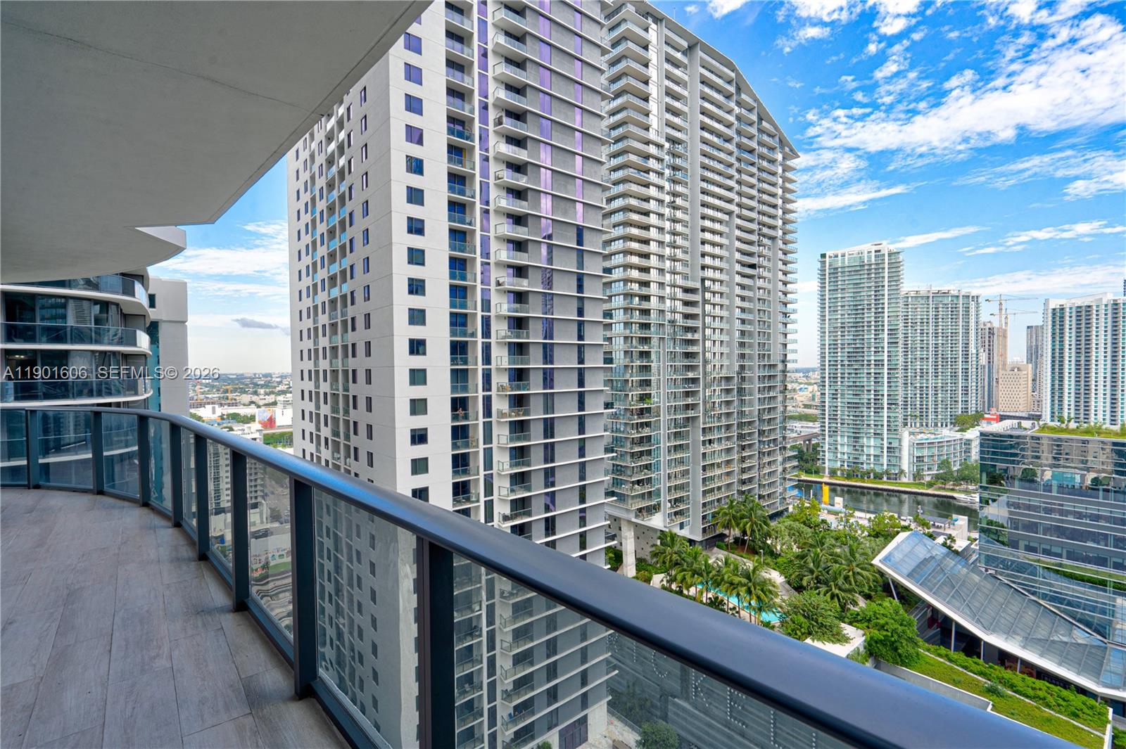 45 Southwest 9th Street, Unit 2408 Miami, FL 33130 - Photo 20 of 37 a view of balcony with a couple of cars parked in parking lot