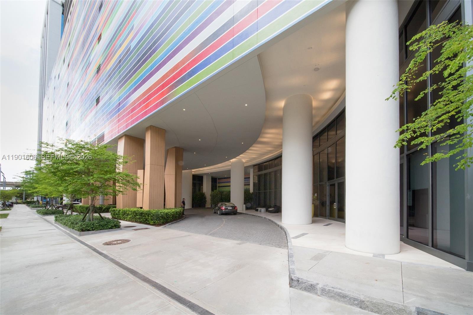 45 Southwest 9th Street, Unit 2408 Miami, FL 33130 - Photo 2 of 37 a view of house with outdoor space and tree