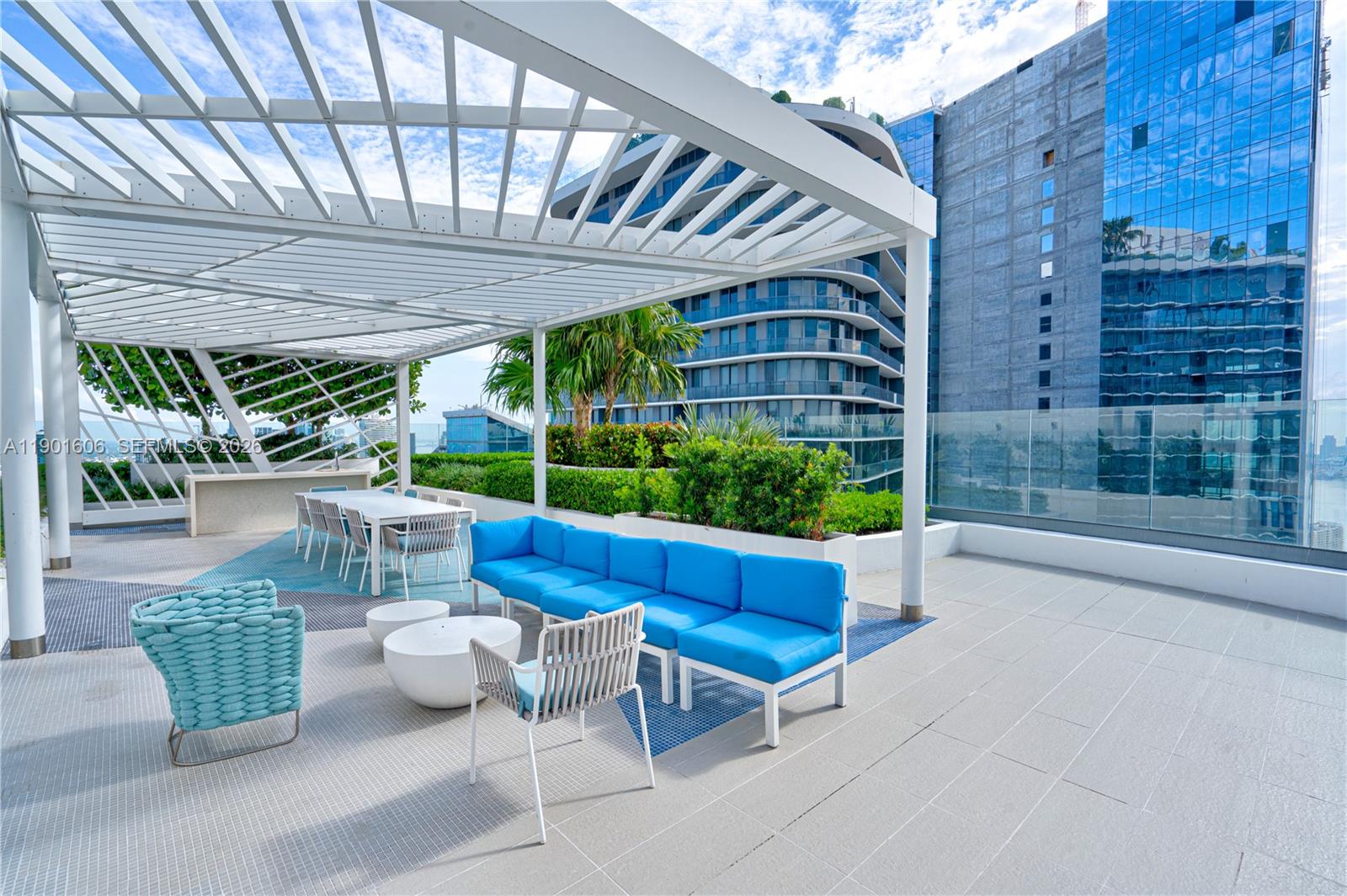 45 Southwest 9th Street, Unit 2408 Miami, FL 33130 - Photo 25 of 37 a building outdoor space with patio furniture and potted plants