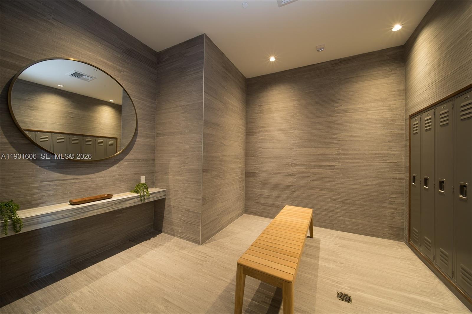 45 Southwest 9th Street, Unit 2408 Miami, FL 33130 - Photo 35 of 37 a bathroom with a sink and a mirror