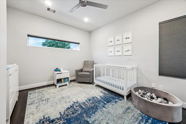 a bedroom with furniture and a window