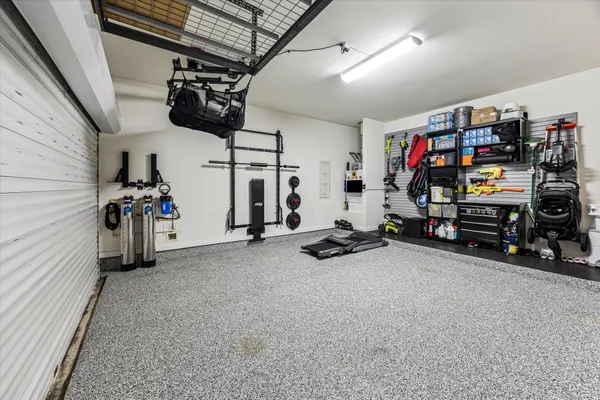 a view of a storage room with furniture fridge and stairs