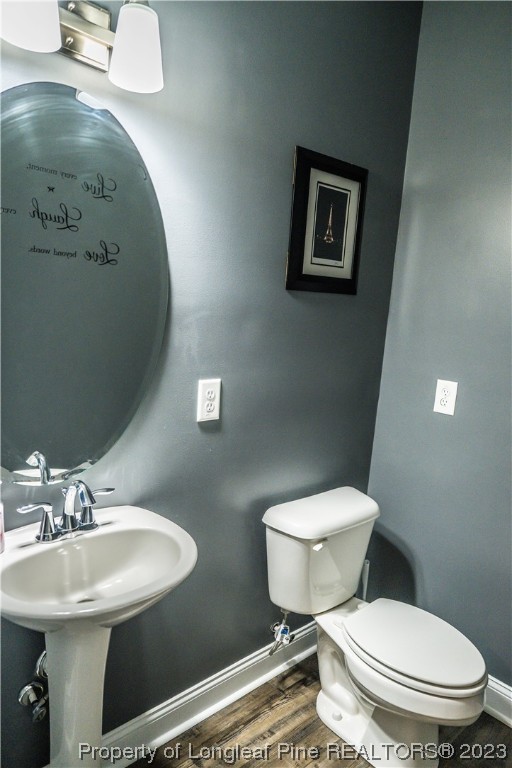 96 Eaker Drive Cameron, NC 28326 - Photo 15 of 41 a bathroom with a toilet sink and mirror