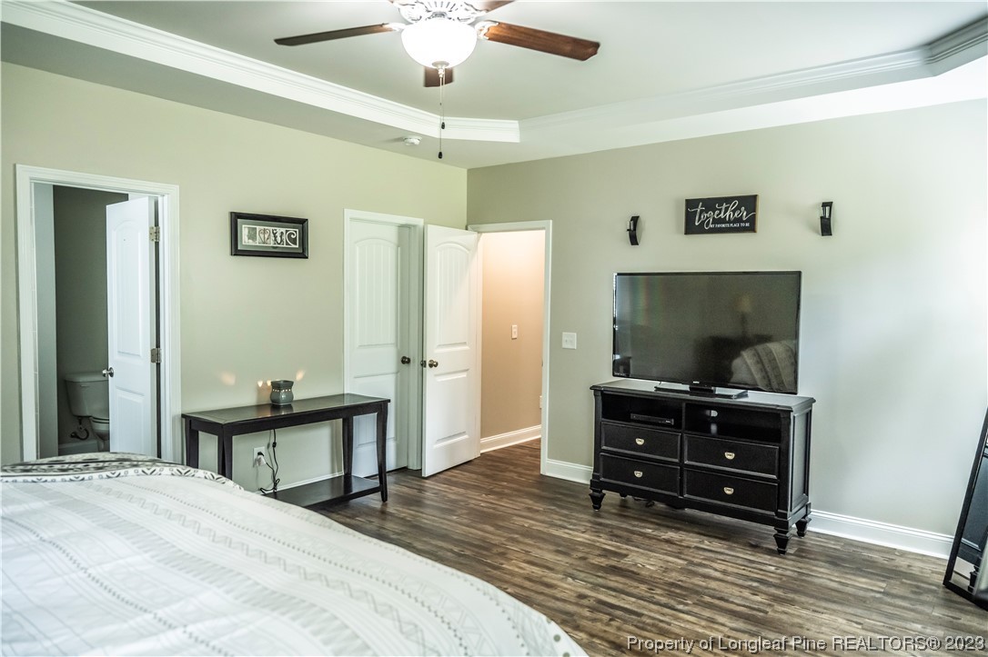 96 Eaker Drive Cameron, NC 28326 - Photo 18 of 41 a bedroom with a bed and furniture