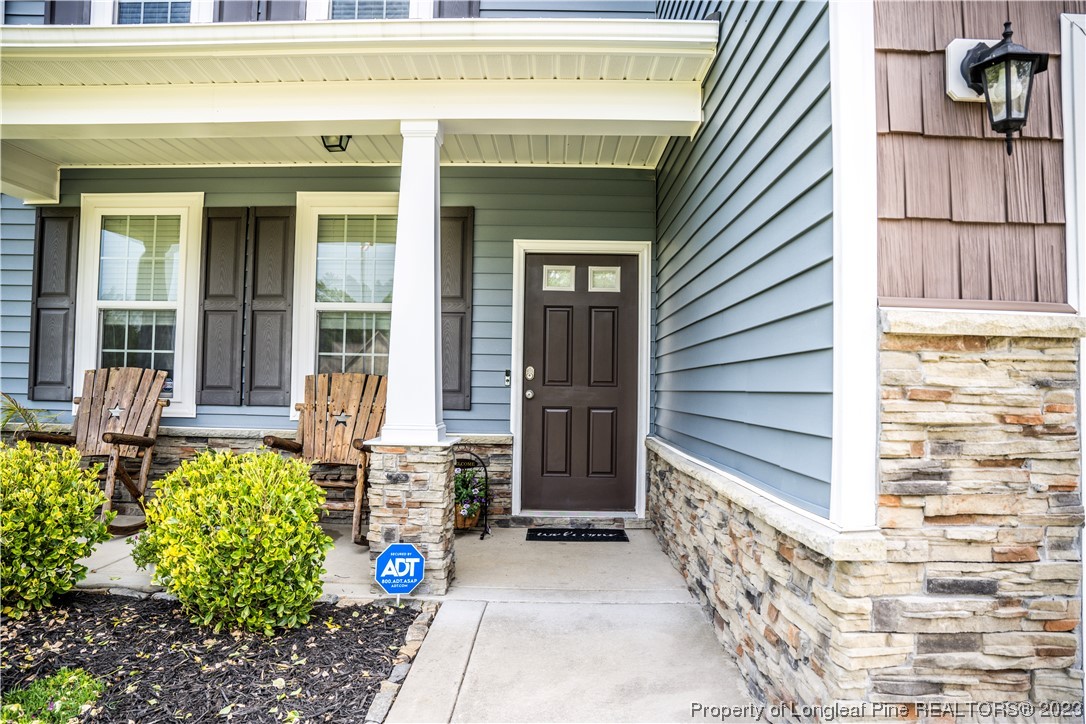 96 Eaker Drive Cameron, NC 28326 - Photo 4 of 41 a front view of a house with a yard