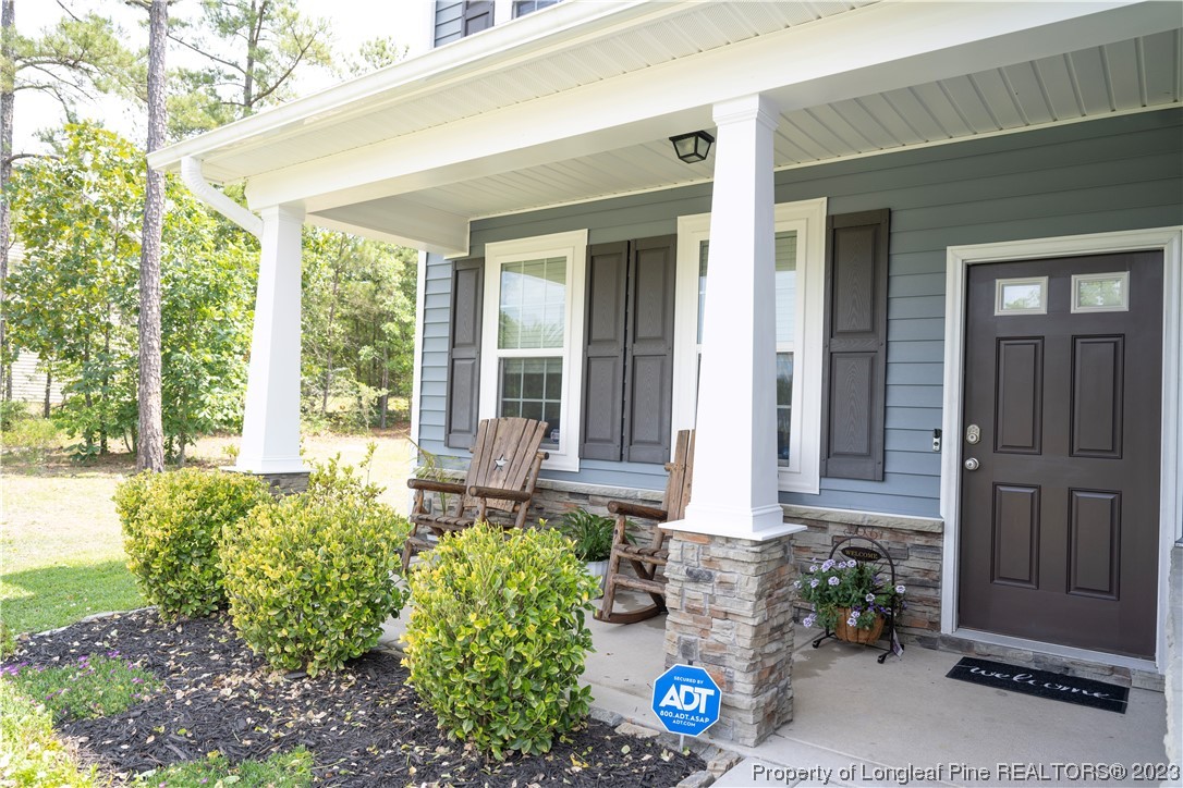 96 Eaker Drive Cameron, NC 28326 - Photo 5 of 41 a front view of a house with a yard