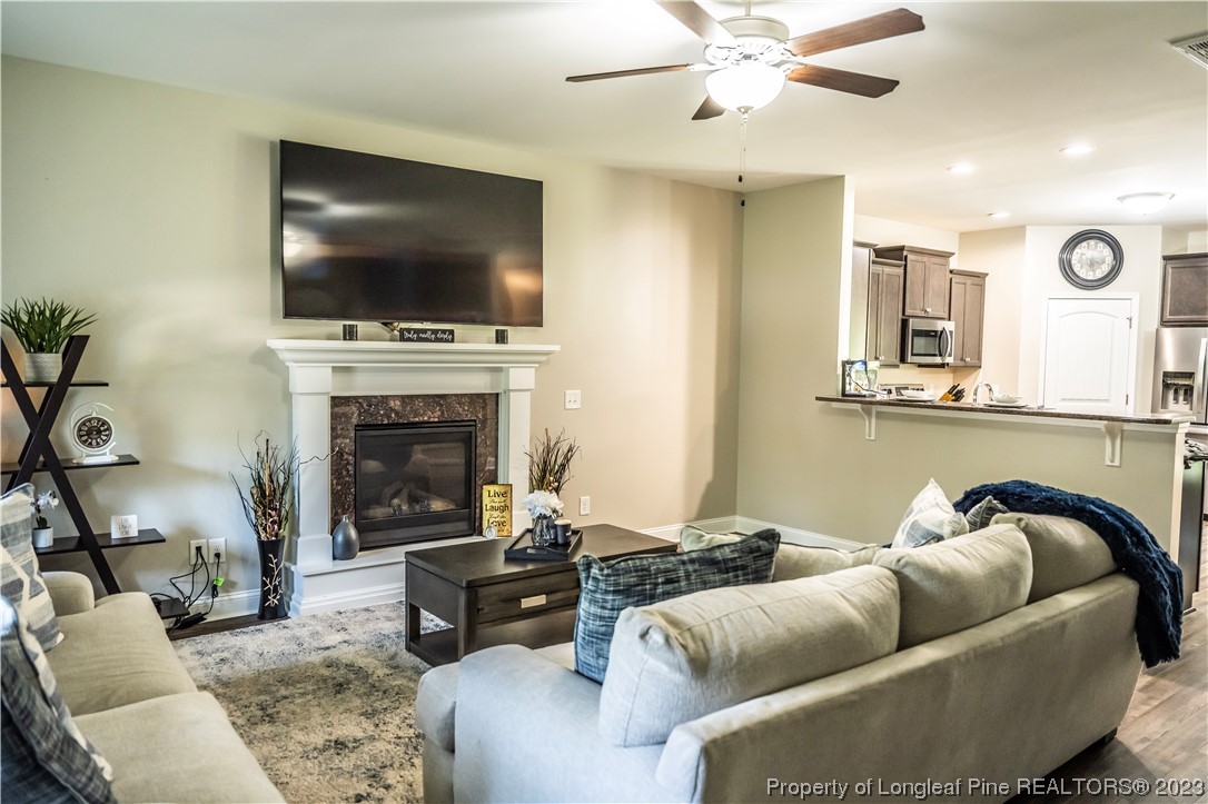 96 Eaker Drive Cameron, NC 28326 - Photo 9 of 41 a living room with furniture and a flat screen tv