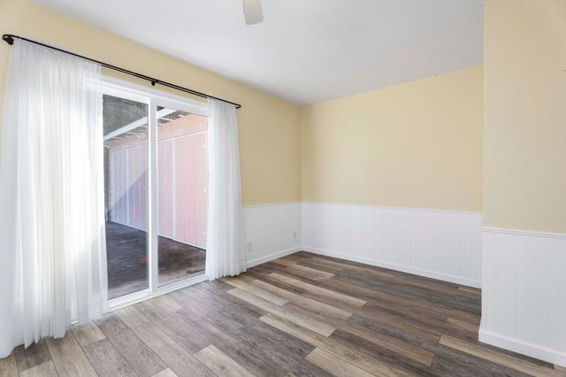 an empty room with wooden floor