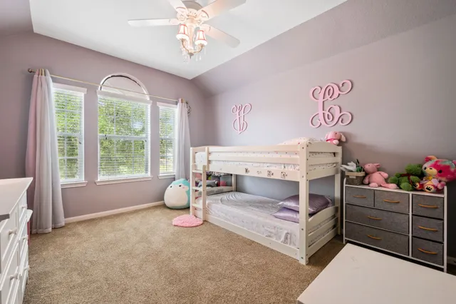 a living room with furniture and windows