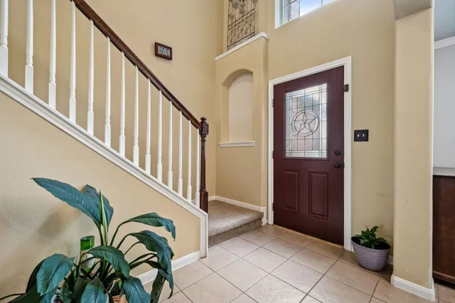 a view of an entryway with flower pots